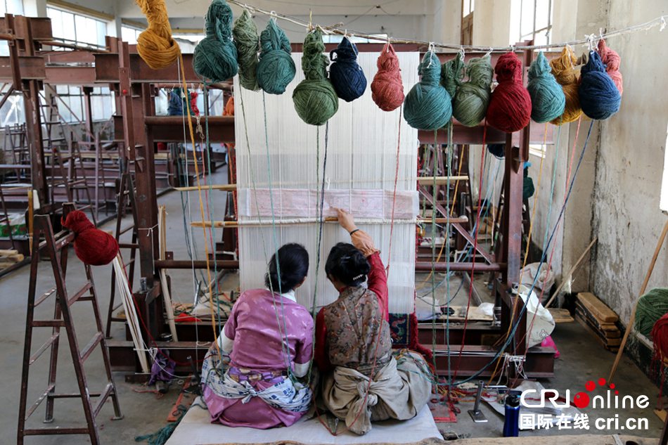 Legend on fingertip: the birth of a Tibetan carpet