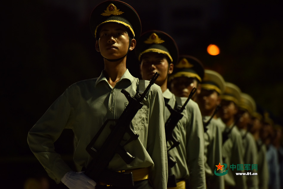 Chinese soldiers conduct training at night for V-Day parade