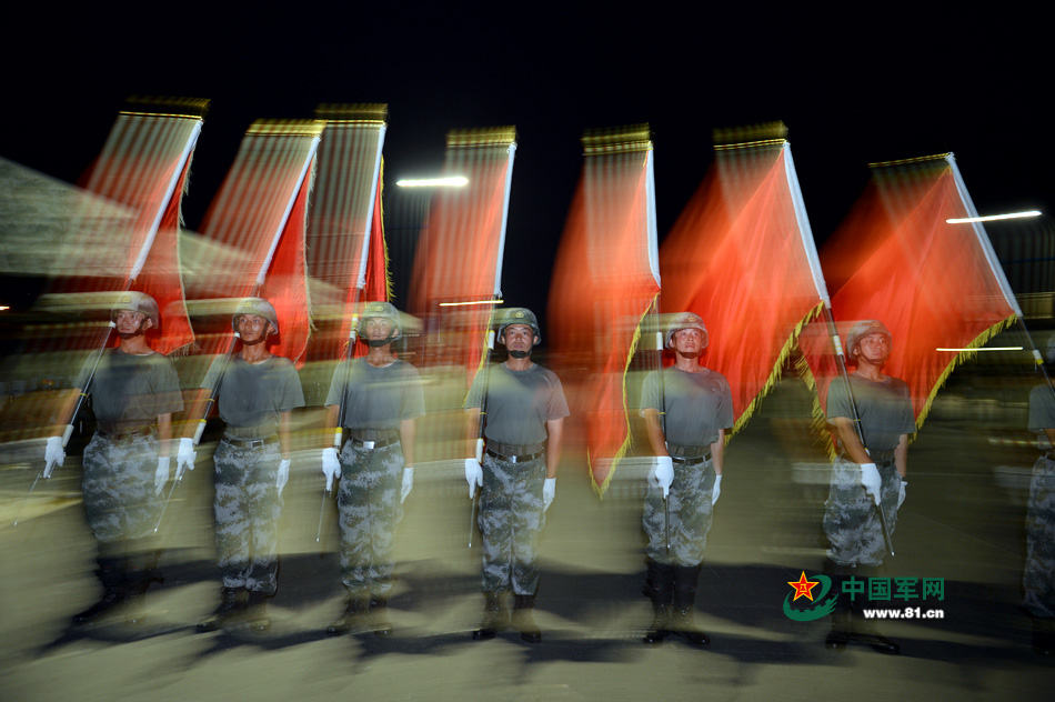 Chinese soldiers conduct training at night for V-Day parade