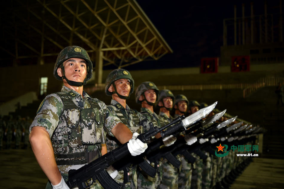 Chinese soldiers conduct training at night for V-Day parade