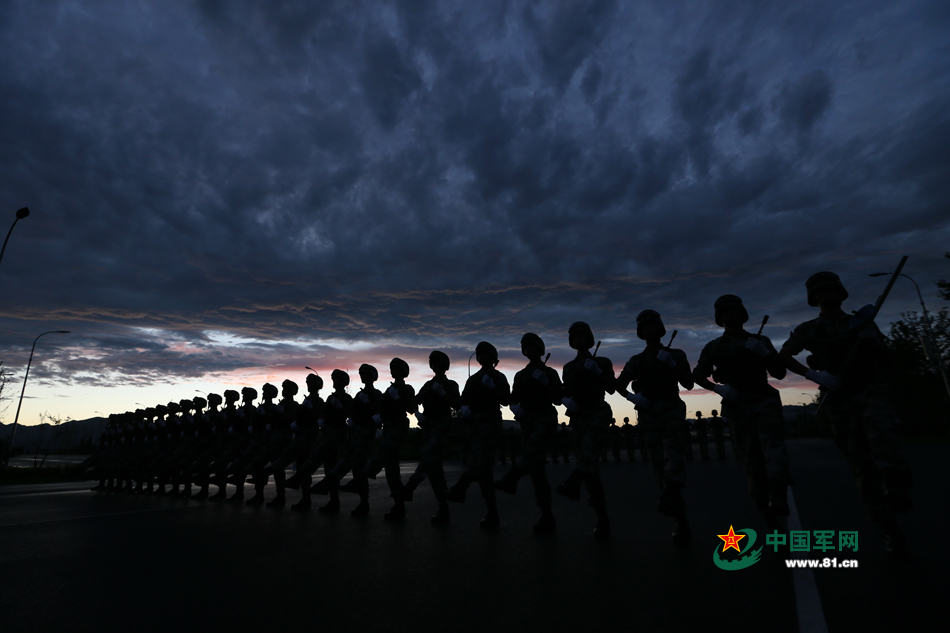 Chinese soldiers conduct training at night for V-Day parade