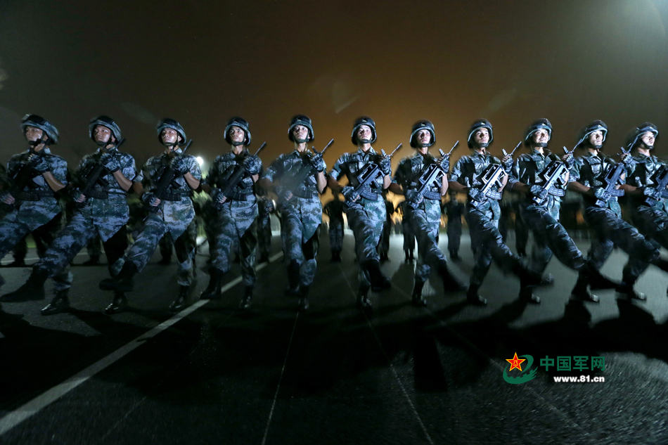 Chinese soldiers conduct training at night for V-Day parade