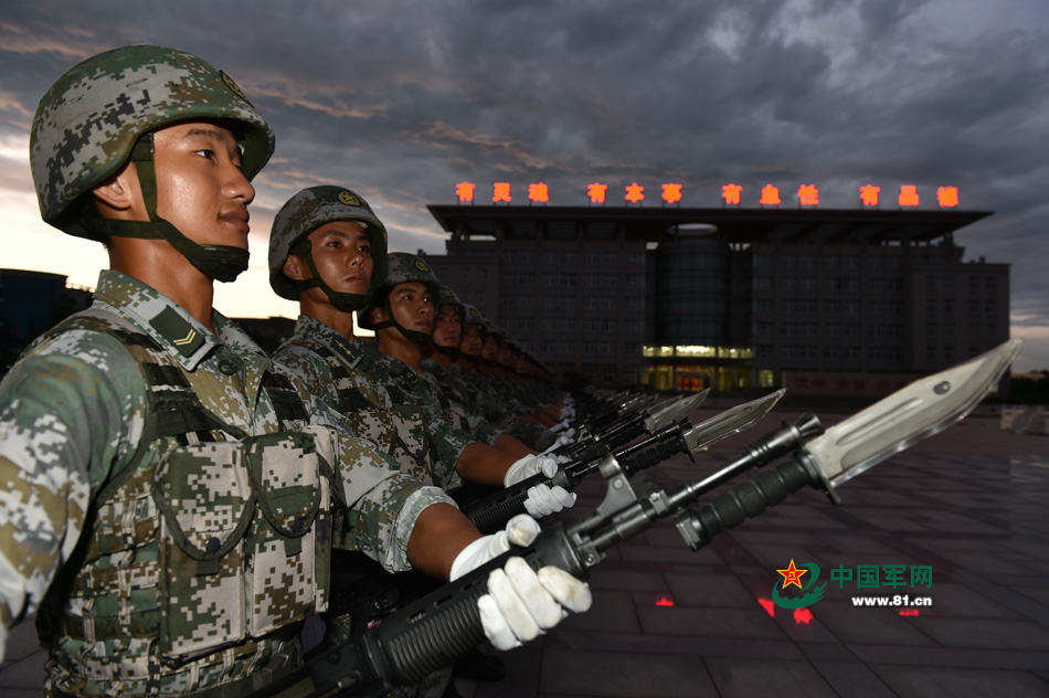 Chinese soldiers conduct training at night for V-Day parade