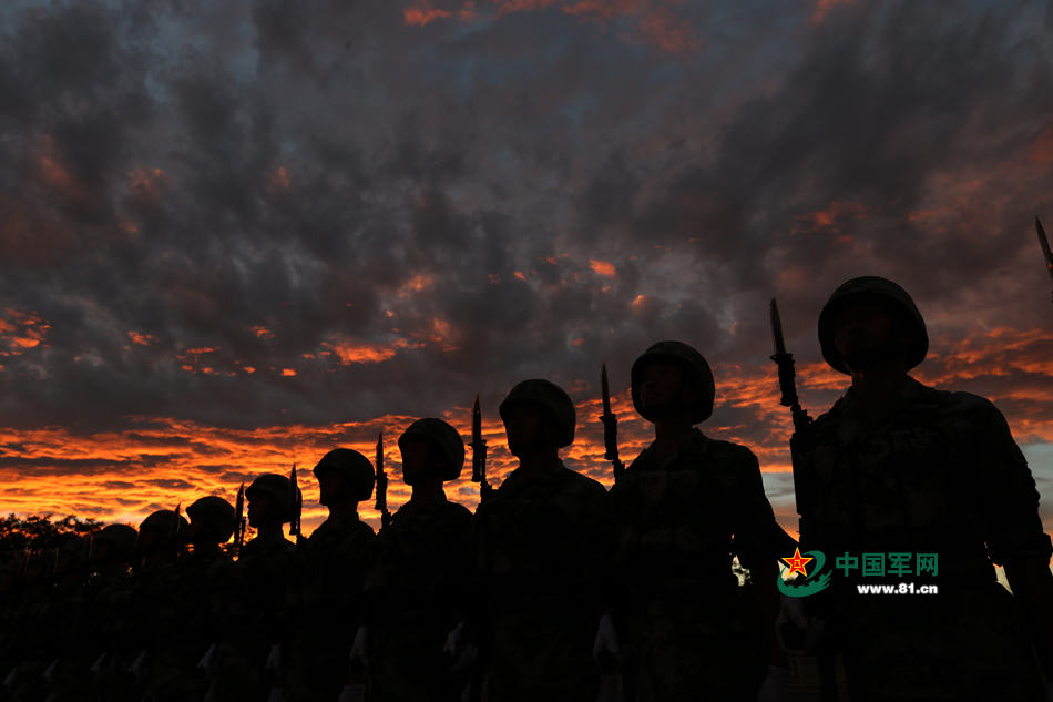 Chinese soldiers conduct training at night for V-Day parade