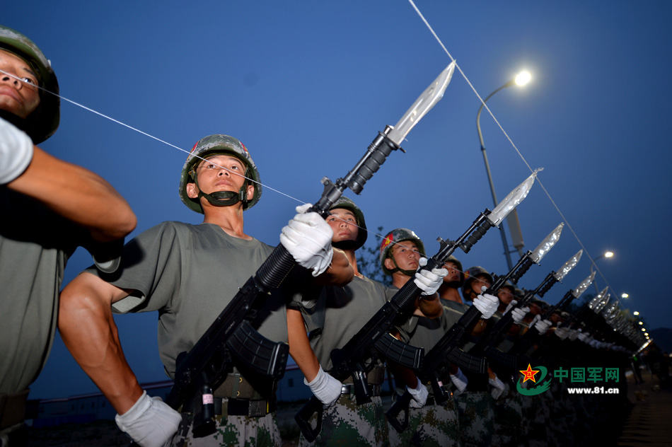 Chinese soldiers conduct training at night for V-Day parade