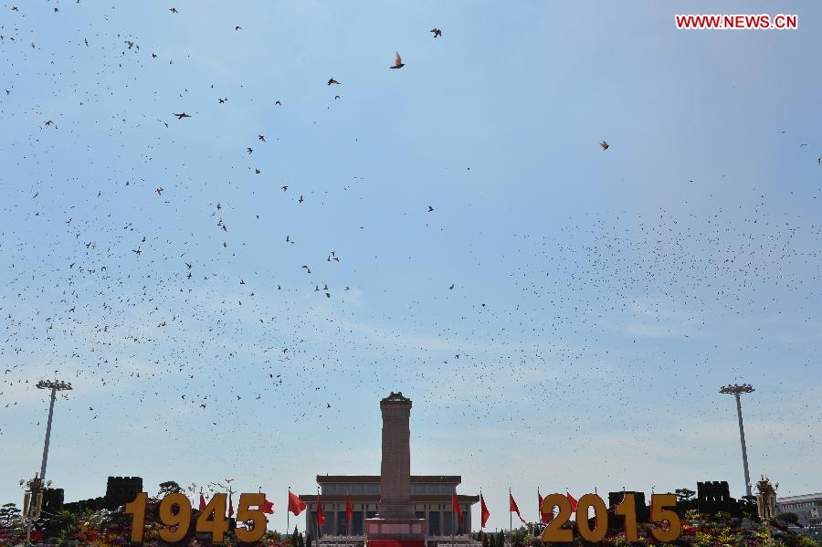 Hundreds and thousands of white doves are released, marking the end of the grand V-Day parade