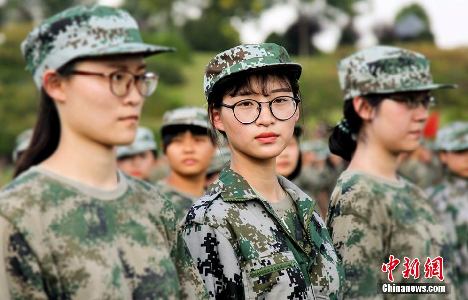 Charming girls attend military training