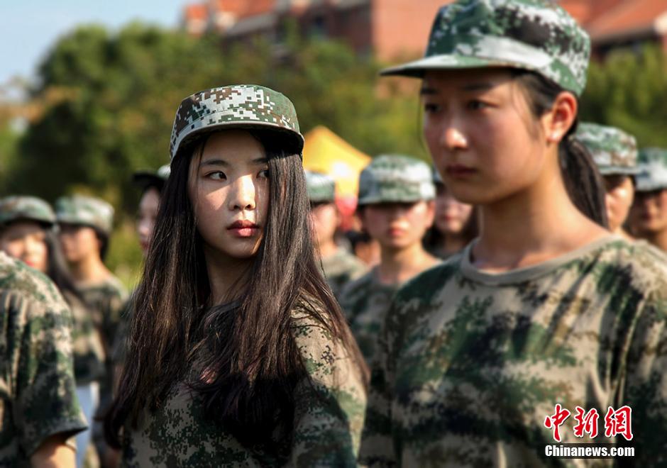 Charming girls attend military training