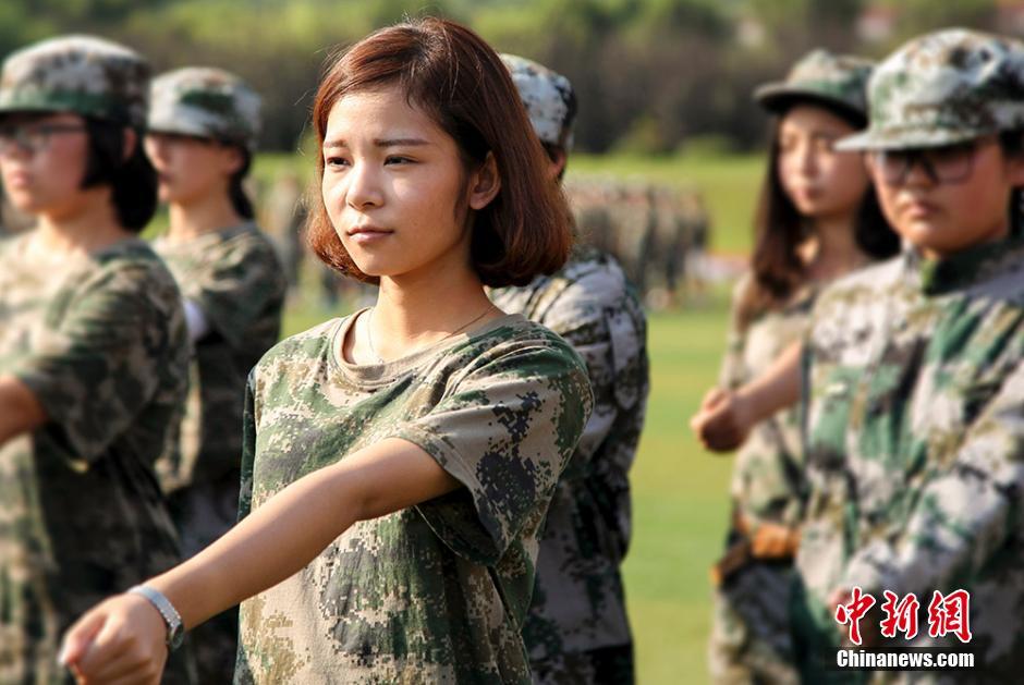 Charming girls attend military training