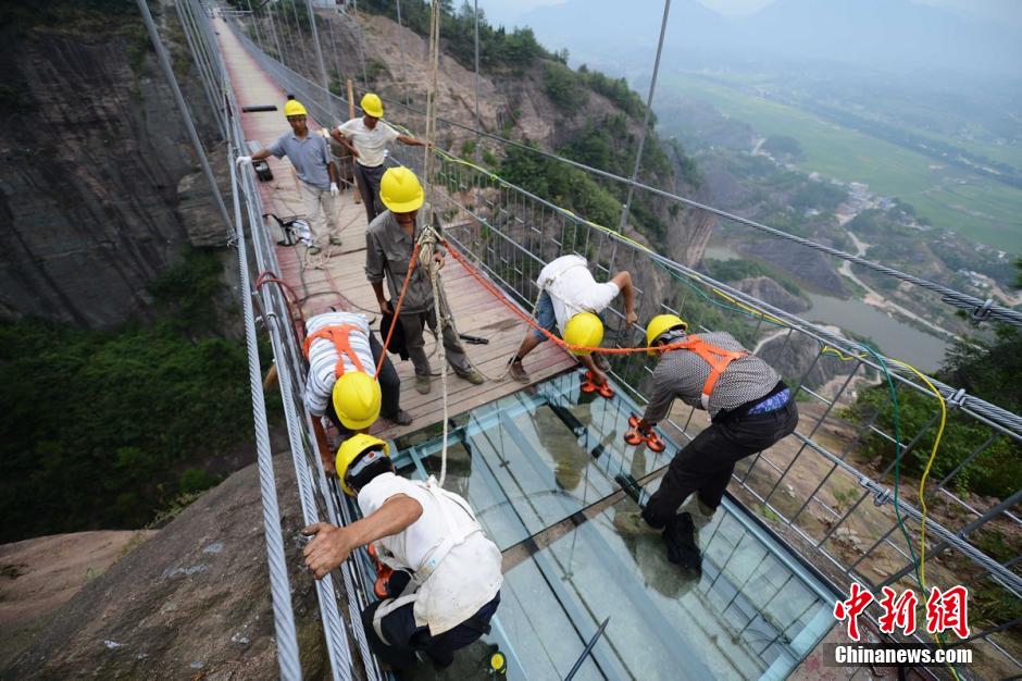 Photo story: a peek at constructors of a suspension bridge