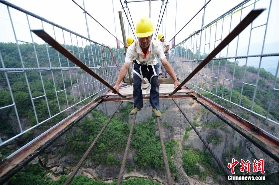 Photo story: a peek at constructors of a suspension bridge