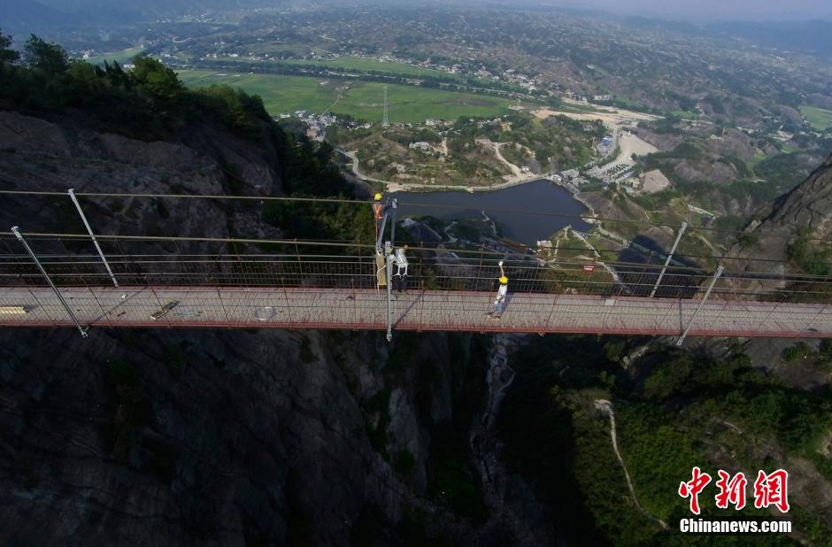 Photo story: a peek at constructors of a suspension bridge