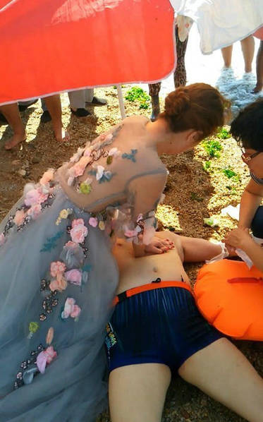 Bride-to-be tries to save drowned man while taking wedding photos