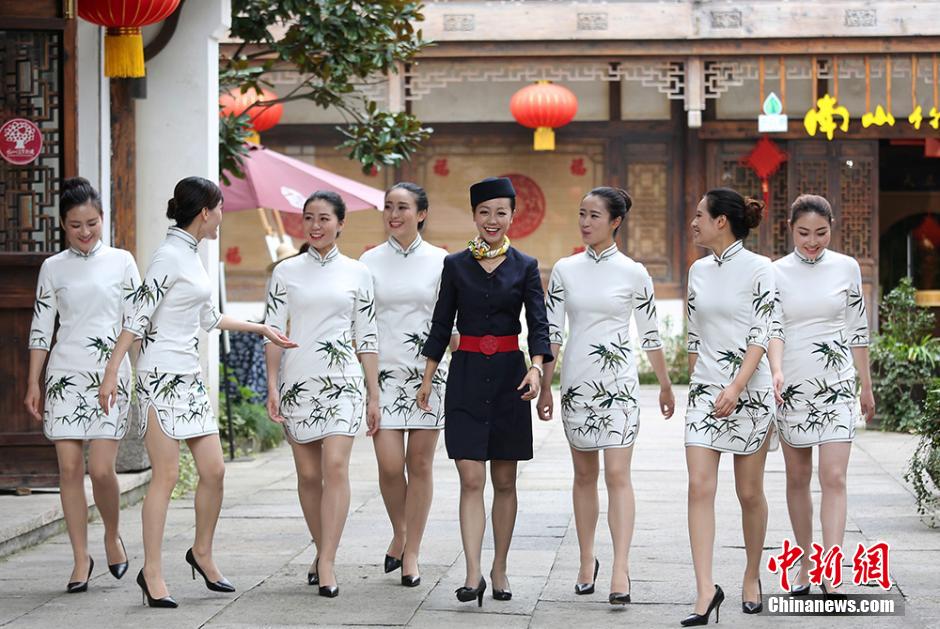 Girls practice smile with chopsticks