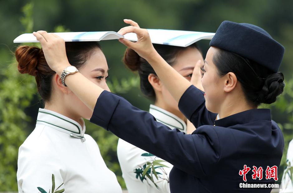 Girls practice smile with chopsticks