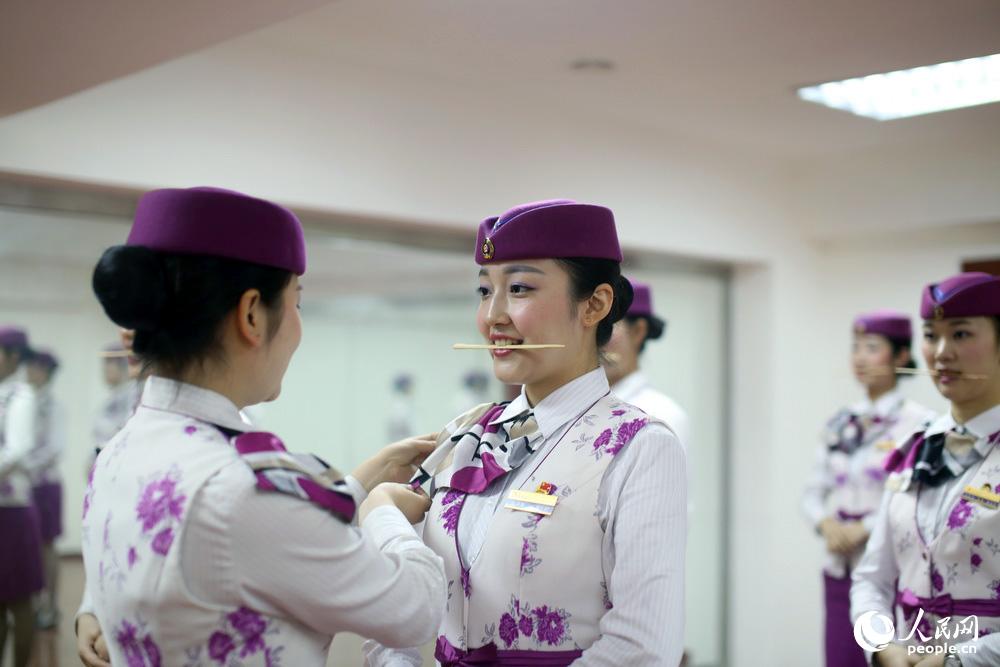 Train stewardesses receive harsh etiquette training 