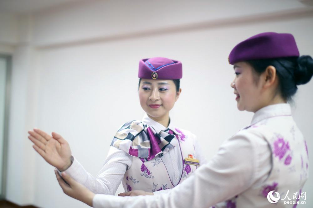 Train stewardesses receive harsh etiquette training 