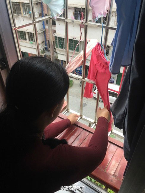 Woman saves baby stuck in window rails on fifth floor
