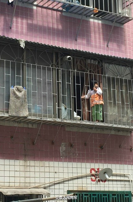 Woman saves baby stuck in window rails on fifth floor
