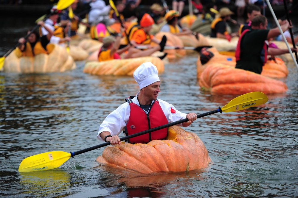 People paddle pumpkins in West Coast Giant Pumpkin Regatta 