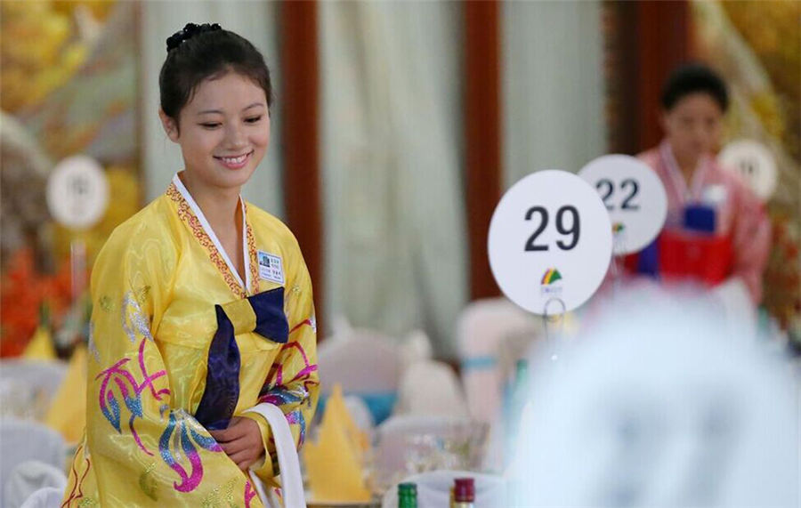 Beautiful DPRK waitresses in Korean families reunion dinner