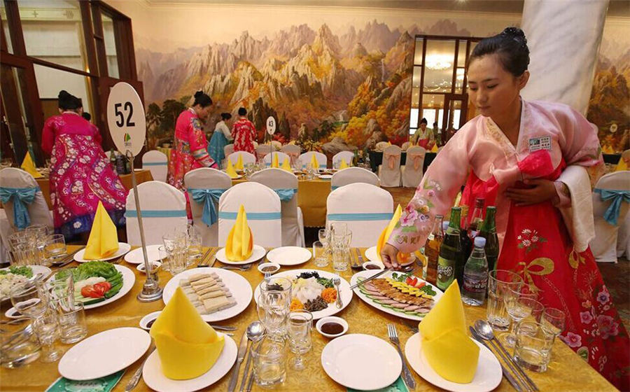 Beautiful DPRK waitresses in Korean families reunion dinner