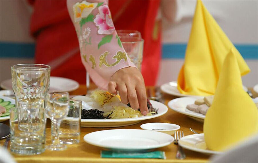 Beautiful DPRK waitresses in Korean families reunion dinner