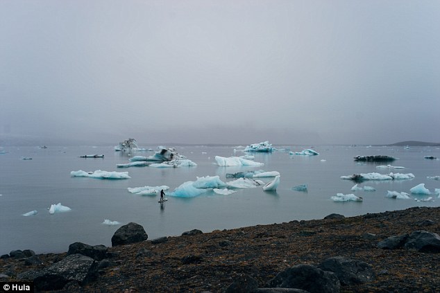 Artist creates stunning portraits of partially submerged women on melting icebergs 