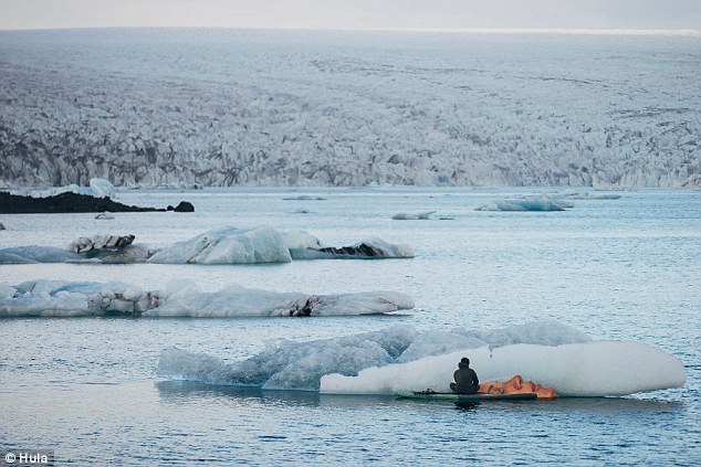 Artist creates stunning portraits of partially submerged women on melting icebergs 