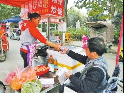 Woman sells fried rice to raise money for operation for her disabled fiancé 