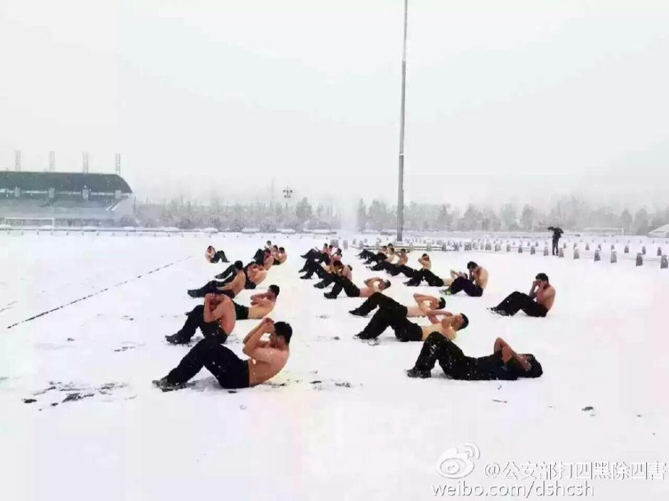 Half naked students take training in snow