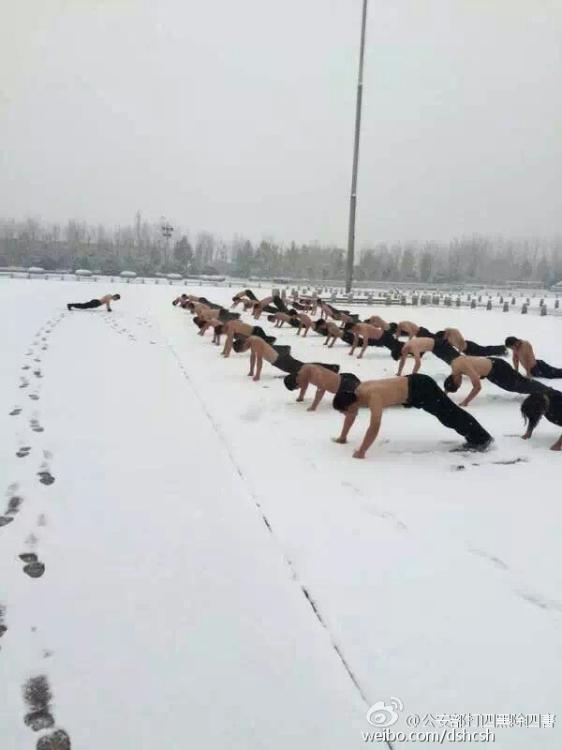 Half naked students take training in snow