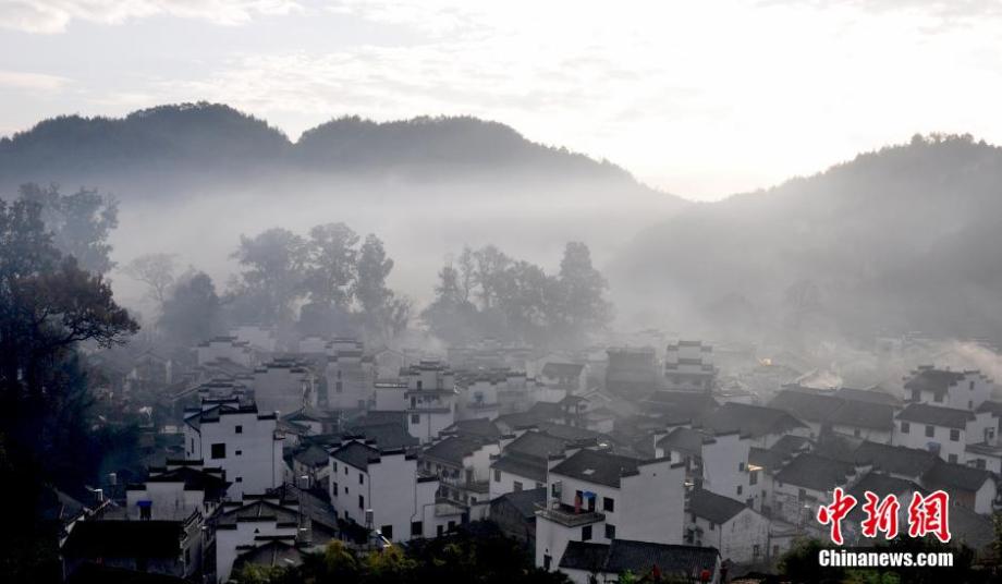 Chinese village shrouded in morning mist