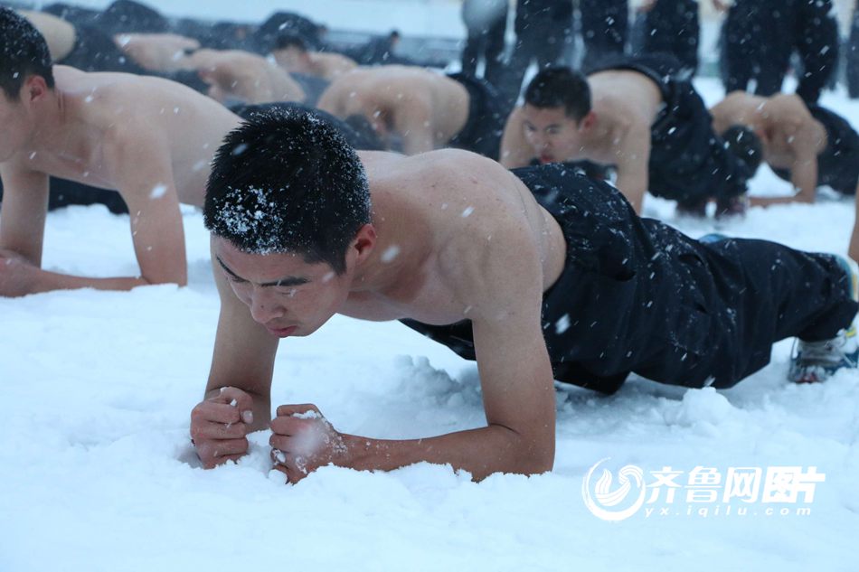 College students brave snow shirtless for training