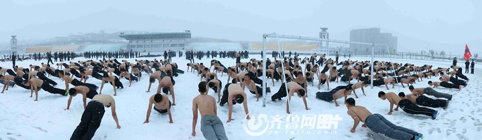 College students brave snow shirtless for training