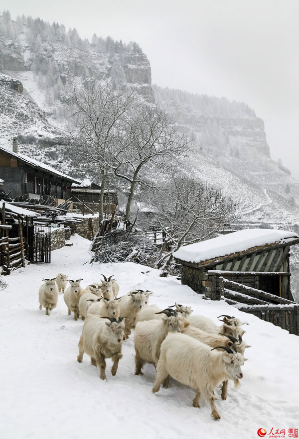 Hanging village on cliff after snow 