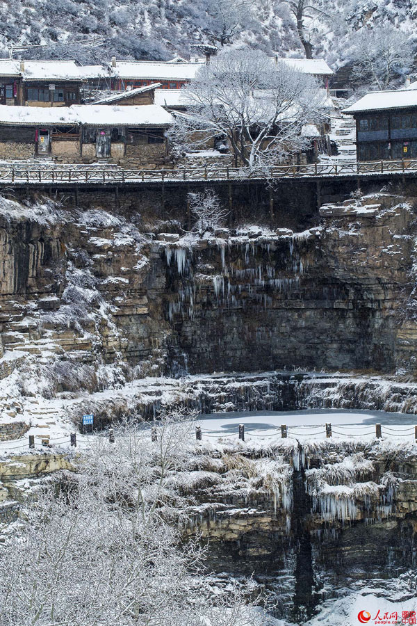 Hanging village on cliff after snow 