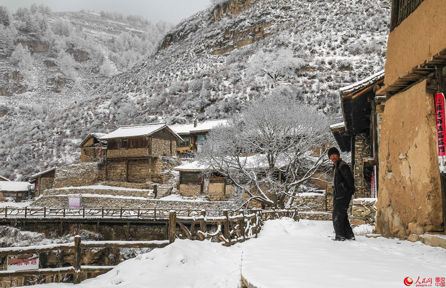 Hanging village on cliff after snow 