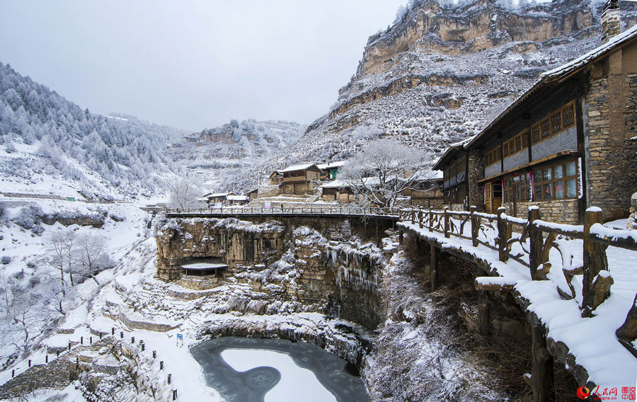 Hanging village on cliff after snow 