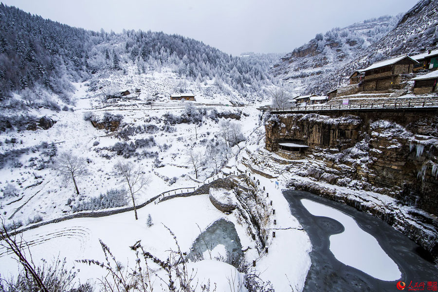 Hanging village on cliff after snow 