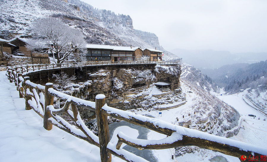 Hanging village on cliff after snow 