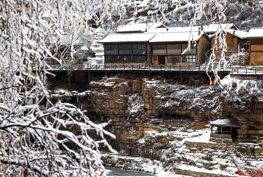 Hanging village on cliff after snow 