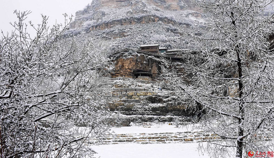 Hanging village on cliff after snow 