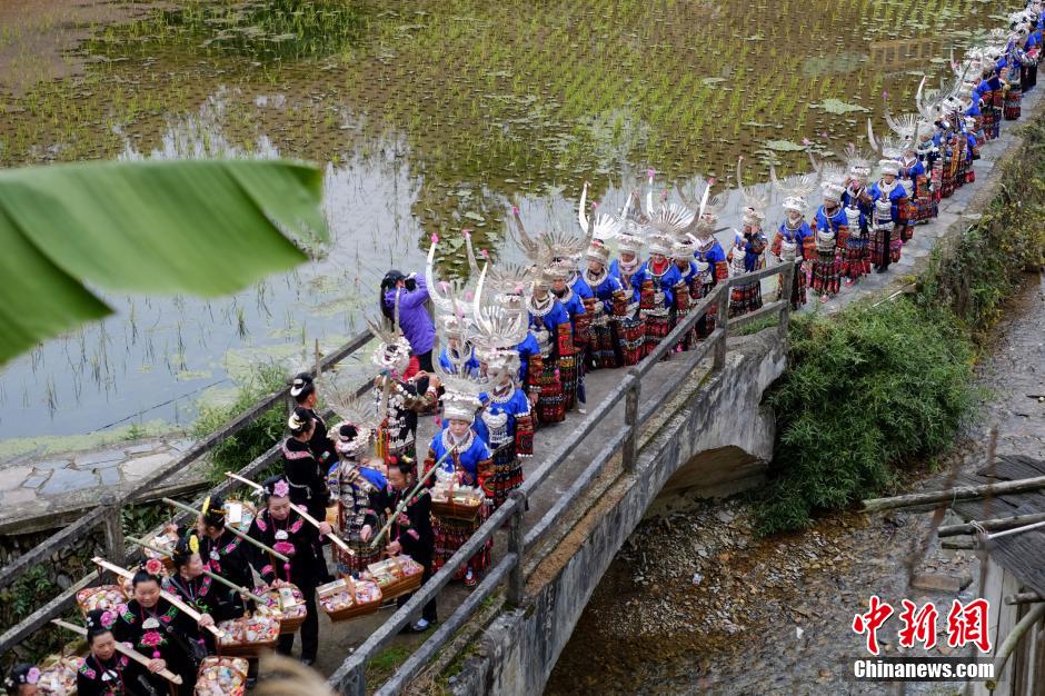 Married women of Miao ethnic group return home for New Year