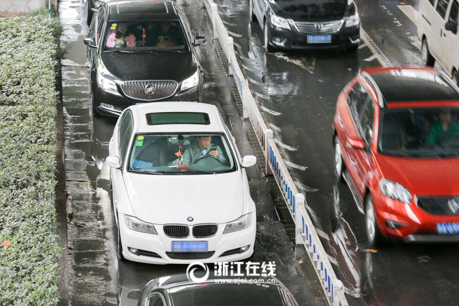 Watch out! Lovers cuddling as they drive a car
