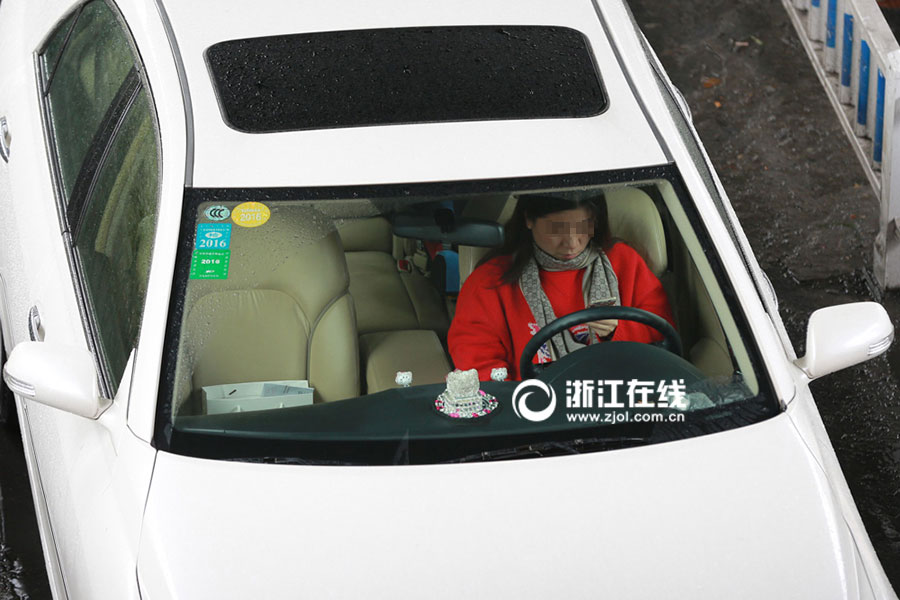 Watch out! Lovers cuddling as they drive a car
