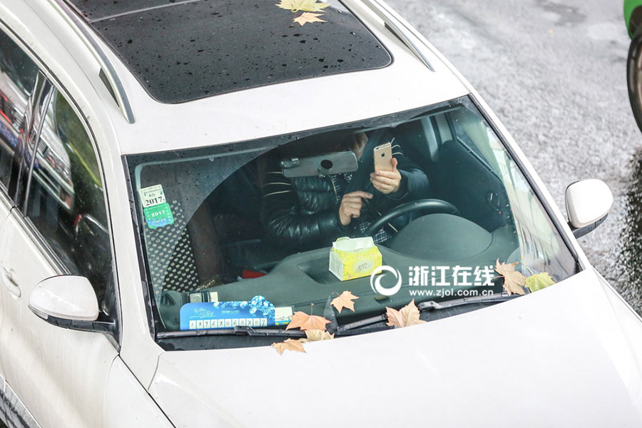 Watch out! Lovers cuddling as they drive a car
