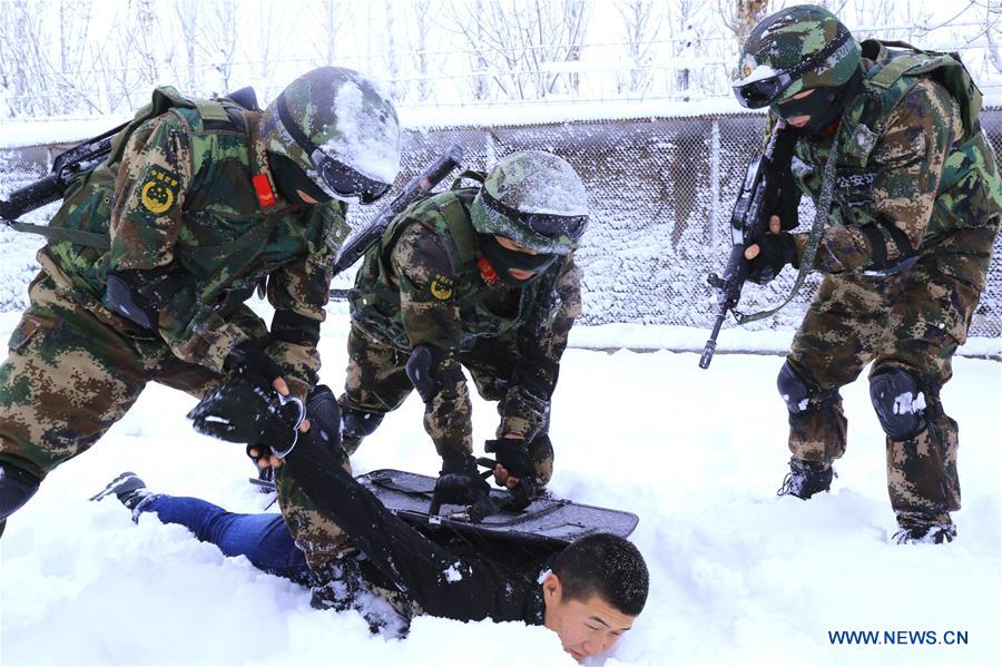 Border defense soldiers attend training in heavy snow in Xinjiang