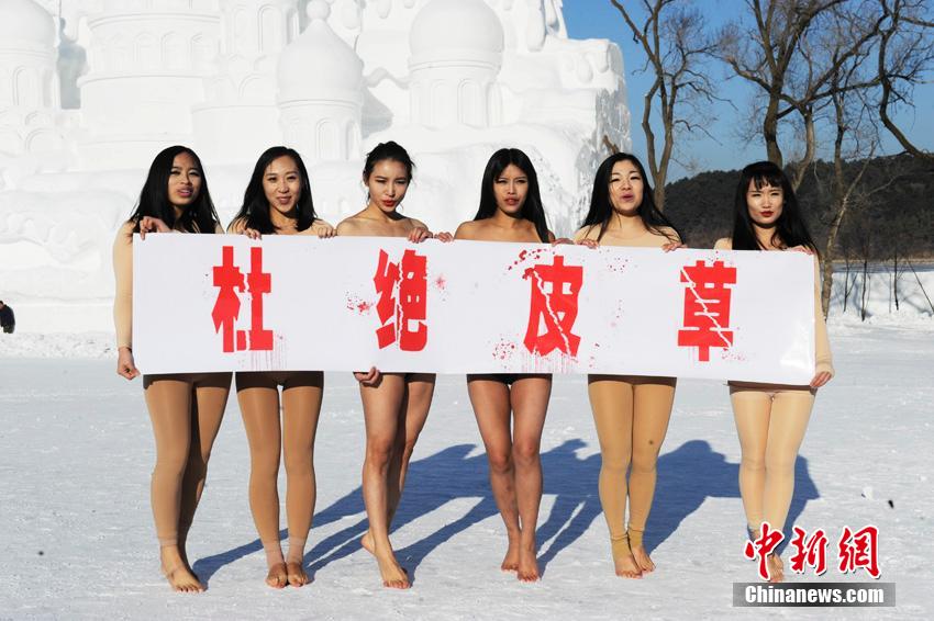 Women perform pole dancing in low temperature