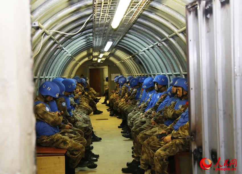 Military engineers with the Chinese peacekeeping force in Lebanon encounter air raids